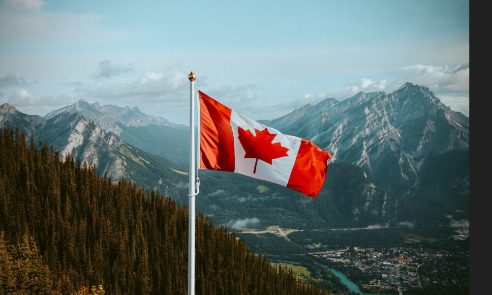 Canadian flag and the view of the amazing rocky mountains