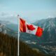 Canadian flag and the view of the amazing rocky mountains