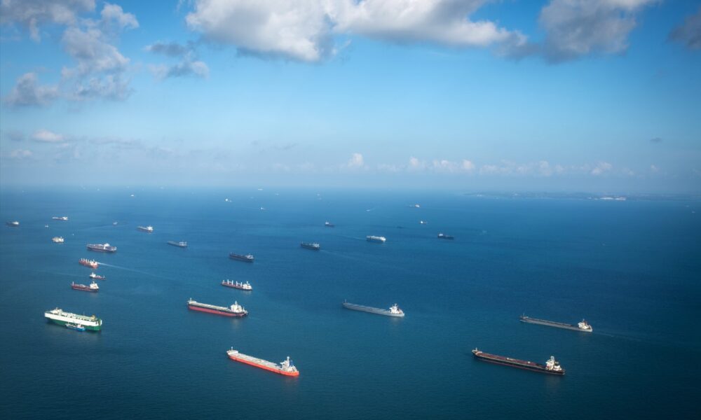 Ships at sea with a blue ocean horizon
