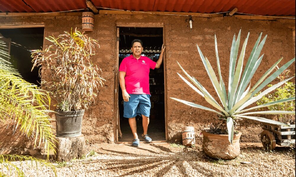 Omar Vazquez in the first sargassum home he ever built