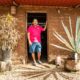 Omar Vazquez in the first sargassum home he ever built