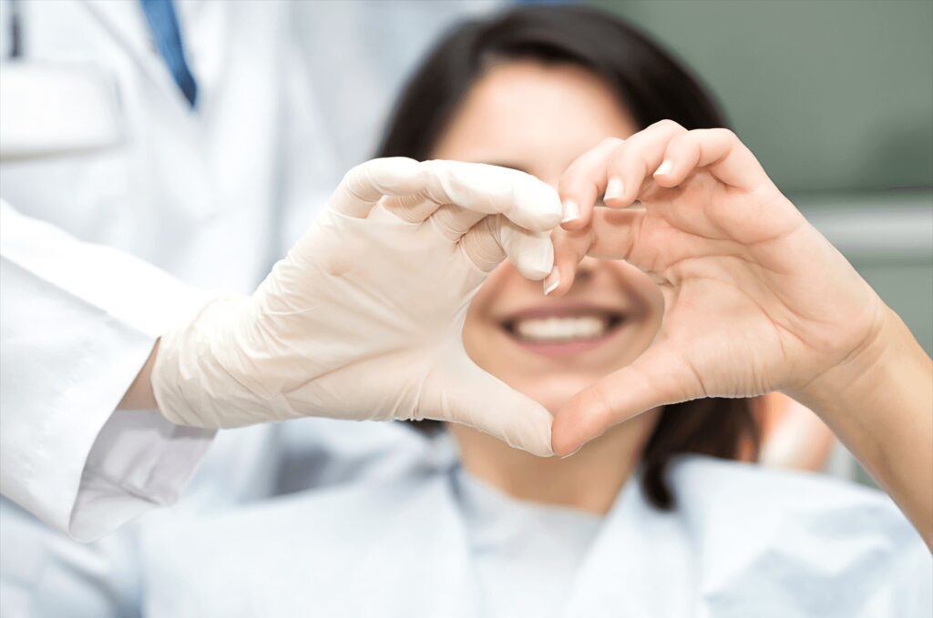 Doctor making a heart shape with her hands 