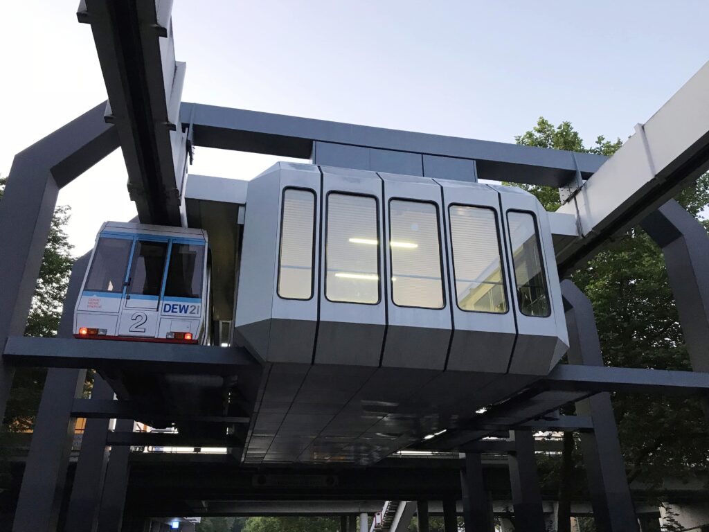 suspension monorail H-bahn Germany going over a bridge