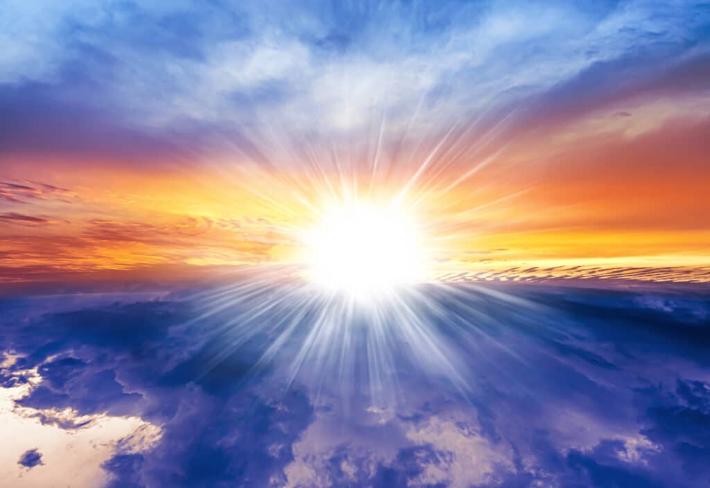 a sun shining through clouds